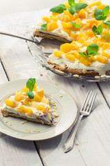Closeup of peaches cake on old wooden table