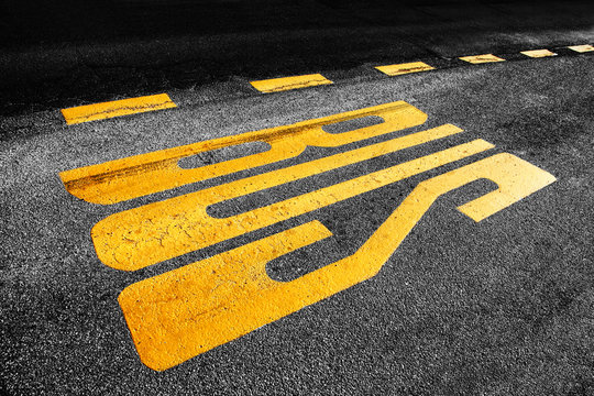 Asphalt bus station sign
