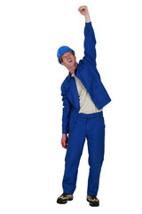Fototapeta premium Manual worker raised clenched fist in the air