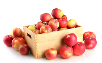 juicy apples in wooden crate, isolated on white