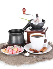 White cup of Turkish coffee with rahat delight, coffee pot and