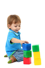 cute little boy with toy color cubes, isolated on white