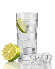 Ice cubes in glass with lime isolated on white