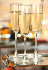 Corporate party: sparkling champagne glasses on tray