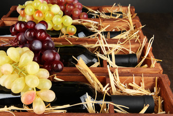 Wooden case with wine bottles close up