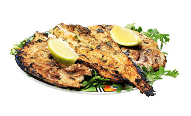 Grilled fish with greens on the plate - isolated on white backgr