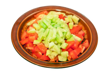 Salad of tomatoes and cucumbers, isolated on white background