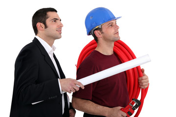 a plumber and a manager watching something