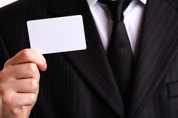 Businessman showing his business card. You can just add your tex
