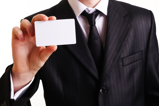 Businessman showing his business card. You can just add your tex