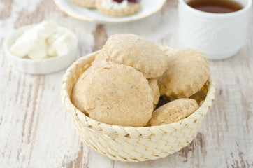 Scone of whole wheat in a wicker basket horizontal