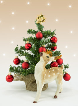 Reindeer and christmas tree