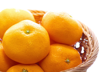 The close up view of tangerines in a basket