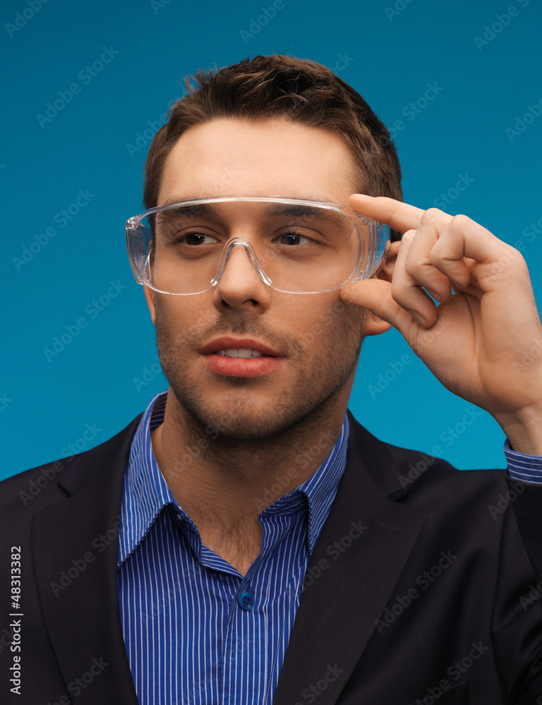 Poster businessman in protective glasses