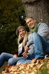 Smiling couple in autumn park