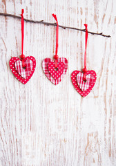 Hearts hanging  on a twig