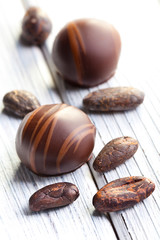 chocolate pralines and cocoa beans
