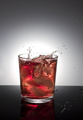 Ice dropping into drink.