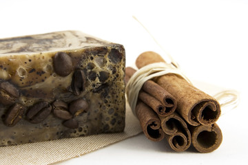spa composition with natural soap and cinnamon sticks