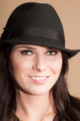 Portrait of beautiful girl in hat 