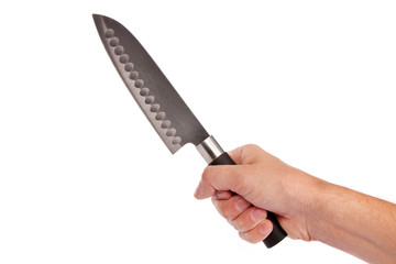 Hand is holding a kitchen kinfe isolated