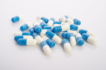 Fototapeta in white blue capsules obraz