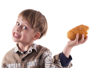 young boy eating donut