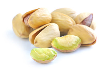 Pistachio nuts on white background