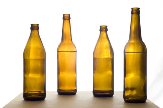 Four Beer Bottles on the Table
