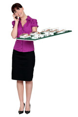 Woman holding model housing