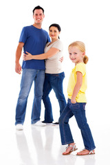 happy young family on white with little girl in front