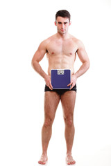 Healthy young man with a weight scale Isolated