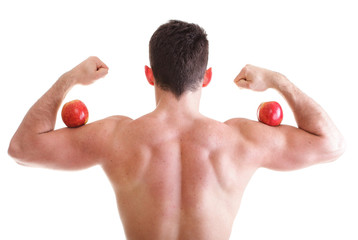 Athletic sexy male body builder holding red apple