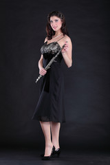 elegant woman and flute on a black background