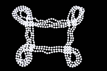 beads of pearls on a black background