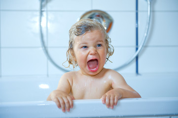 happy child in the bath tub