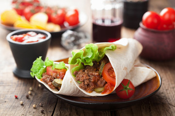 tortilla wraps with meat and vegetables