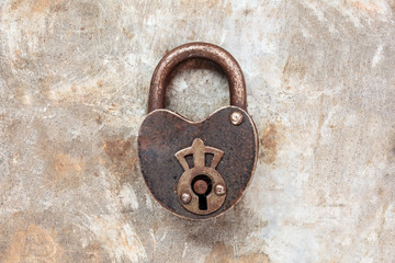 Vintage padlock on an iron grunge background