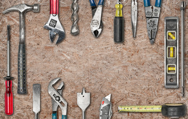 Group of used tools on wood
