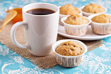 Fresh vegan banana muffin with a cup of coffee