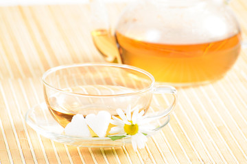 teacup with herbal chamomile tea