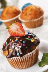 Chocolate muffin with strawberry on top