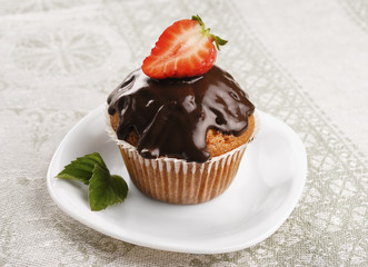 Chocolate muffin with strawberry on top