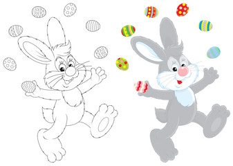 Easter Bunny juggling with painted eggs