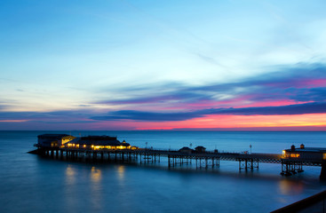 Fototapeta na wymiar cromer pier at sunrise on english coast