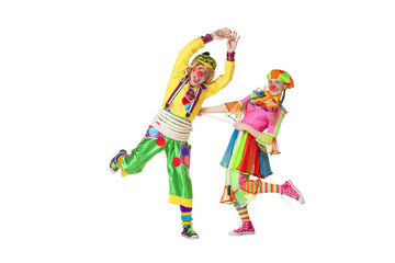 Two smiling clowns  isolated over a white background