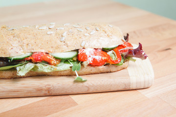 Chicken Salad Sandwich on wooden cutting board
