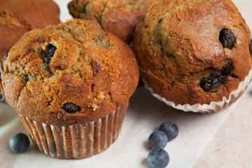 Group of fresh baked golden blueberry muffins