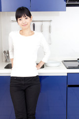a young asian woman in the kitchen