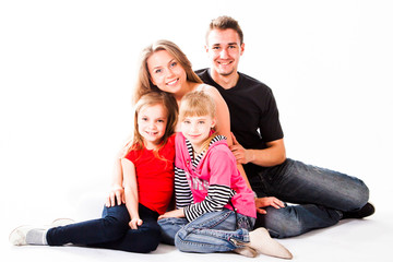 Happy family of parents and young children